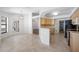 Bright kitchen with wood cabinets, tile backsplash, and a view of the dining area at 1061 Archway Dr, Spring Hill, FL 34608
