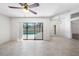 Living room with tile and access to lanai at 1061 Archway Dr, Spring Hill, FL 34608