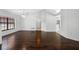 Bright living room features wood floors, and big windows at 1061 Archway Dr, Spring Hill, FL 34608