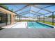 Covered screened pool with bright sun and nice backyard at 1061 Archway Dr, Spring Hill, FL 34608