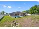 Backyard featuring an enclosed pool with a screened in patio at 1061 Archway Dr, Spring Hill, FL 34608