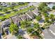 Aerial view of houses, palm trees, and neatly arranged lawns in a residential area at 11207 Flora Springs Dr, Riverview, FL 33579