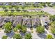 An aerial view features the home, neighboring houses, green lawns, and tree-lined streets at 11207 Flora Springs Dr, Riverview, FL 33579