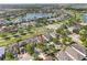 Aerial view of homes with landscaping, and access to community water features at 11207 Flora Springs Dr, Riverview, FL 33579