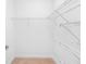 Walk-in closet featuring wire shelving and neutral colored carpet at 11207 Flora Springs Dr, Riverview, FL 33579