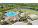 Aerial perspective of community pool, playground, and outdoor recreational facilities, surrounded by trees and lawns at 11207 Flora Springs Dr, Riverview, FL 33579