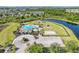 This beautiful community pool has ample parking, playground, and sports court surrounded by lush landscaping and lakes at 11207 Flora Springs Dr, Riverview, FL 33579