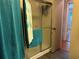 This bathroom features a glass shower and turquoise towels at 12501 Ulmerton Rd # 216, Largo, FL 33774