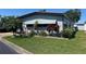 Home with landscaped yard and a palm tree at 12501 Ulmerton Rd # 216, Largo, FL 33774