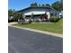 Charming home with well-maintained lawn and colorful plants at 12501 Ulmerton Rd # 216, Largo, FL 33774