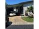 Cozy home with convenient covered parking and tidy landscaping at 12501 Ulmerton Rd # 216, Largo, FL 33774