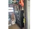 Laundry room with newer gray front load washer and dryer on pedestals for easier loading at 12501 Ulmerton Rd # 216, Largo, FL 33774