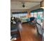 Living area with wood flooring, large bed and multiple windows at 12501 Ulmerton Rd # 216, Largo, FL 33774