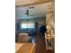 Living room with hardwood floors, ceiling fan and large blue couch at 12501 Ulmerton Rd # 216, Largo, FL 33774