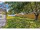 A backyard with well-kept green grass and a wooden fence at 12641 98Th St, Largo, FL 33773