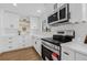 This is a closer view of the modern stainless steel oven and microwave in the beautiful kitchen at 12641 98Th St, Largo, FL 33773