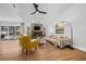 Spacious living room featuring a stone fireplace, wood floors, and comfortable seating at 12641 98Th St, Largo, FL 33773