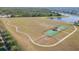 Aerial view of sports field, basketball court, and walking path in the community at 13334 Palmera Vista Dr, Riverview, FL 33579