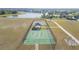 Aerial view of community recreation area with basketball court, sports equipment, and lake views at 13334 Palmera Vista Dr, Riverview, FL 33579