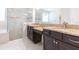 Bathroom featuring double granite vanities and a glass shower with a built-in tub at 13334 Palmera Vista Dr, Riverview, FL 33579