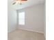 Cozy bedroom with carpet flooring, a window with blinds, and neutral walls at 13334 Palmera Vista Dr, Riverview, FL 33579