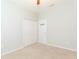 Neutral bedroom featuring carpet flooring, white walls, and a closet for ample storage at 13334 Palmera Vista Dr, Riverview, FL 33579
