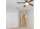 Bedroom featuring a ceiling fan, carpet, a closet, and light coming from a window at 13334 Palmera Vista Dr, Riverview, FL 33579