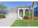 Charming single-story home featuring an attached two-car garage and well-maintained landscaping at 13334 Palmera Vista Dr, Riverview, FL 33579