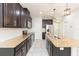 Spacious kitchen boasts a large island, stainless steel appliances, and dark wood cabinets at 13334 Palmera Vista Dr, Riverview, FL 33579