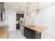 Kitchen with stainless steel appliances, island with sink, and ample cabinet space at 13334 Palmera Vista Dr, Riverview, FL 33579