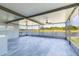 Screened lanai boasts scenic water views, ceiling fans, and a built in bar at 13334 Palmera Vista Dr, Riverview, FL 33579