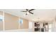 Cozy living room with view to modern kitchen and neutral wall colors at 13334 Palmera Vista Dr, Riverview, FL 33579