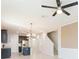 Open-concept living space with staircase and view of the modern kitchen at 13334 Palmera Vista Dr, Riverview, FL 33579