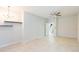 Bright, open living area with tile floors, ceiling fan and stylish chandelier with access to the staircase at 13334 Palmera Vista Dr, Riverview, FL 33579