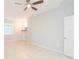 Spacious living room with tile flooring, a ceiling fan, a chandelier, and bright natural light at 13334 Palmera Vista Dr, Riverview, FL 33579