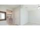 Open-concept living room with tile flooring, neutral paint, and views into the kitchen at 13334 Palmera Vista Dr, Riverview, FL 33579