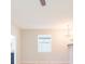 Bright living room features a ceiling fan and large window allowing natural light to fill the space at 13334 Palmera Vista Dr, Riverview, FL 33579