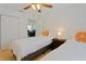 This bedroom features two twin beds, hardwood floors and a ceiling fan at 1411 Gray S St, Gulfport, FL 33707