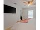 This bedroom features hardwood floors and a mounted flat screen tv at 1411 Gray S St, Gulfport, FL 33707