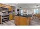 Well-equipped kitchen with a large island, stainless steel appliances, and wood cabinetry at 1411 Gray S St, Gulfport, FL 33707