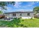 Charming backyard with a patio area, perfect for outdoor entertaining and relaxation at 1545 Illinois Rd, Clearwater, FL 33756