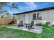 Outdoor patio with chairs, ideal for enjoying the beautiful backyard view at 1545 Illinois Rd, Clearwater, FL 33756