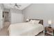 Bedroom featuring a ceiling fan, closet and light wood flooring at 1545 Illinois Rd, Clearwater, FL 33756