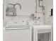 Laundry room with side-by-side washer and dryer at 1545 Illinois Rd, Clearwater, FL 33756