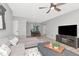 Inviting living room featuring contemporary decor, a comfortable sectional sofa, and an entertainment center at 1545 Illinois Rd, Clearwater, FL 33756