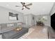 Open-concept living room with modern decor, stylish furnishings, and ample natural light at 1545 Illinois Rd, Clearwater, FL 33756