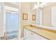 Bathroom featuring a vanity, mirror, shower, tub, and neutral colors at 16419 Chapman Crossing Dr, Lithia, FL 33547