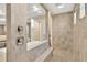 Luxury bathroom with a tiled walk-in shower and seamless glass partition at 16419 Chapman Crossing Dr, Lithia, FL 33547