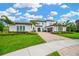 Beautiful home with a well-manicured lawn and garden at 16419 Chapman Crossing Dr, Lithia, FL 33547