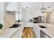 Bright kitchen boasts stainless appliances and quartz countertops at 16419 Chapman Crossing Dr, Lithia, FL 33547